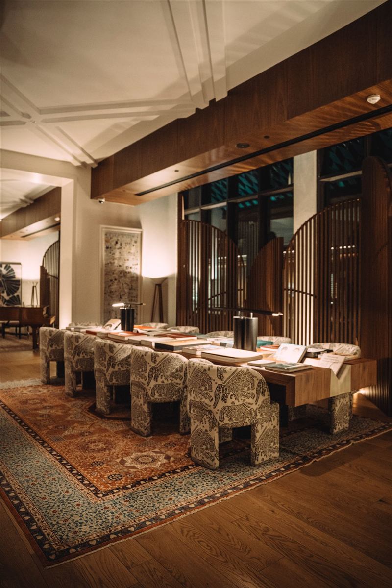 Warm boutique hotel lounge with wood panelling at dusk